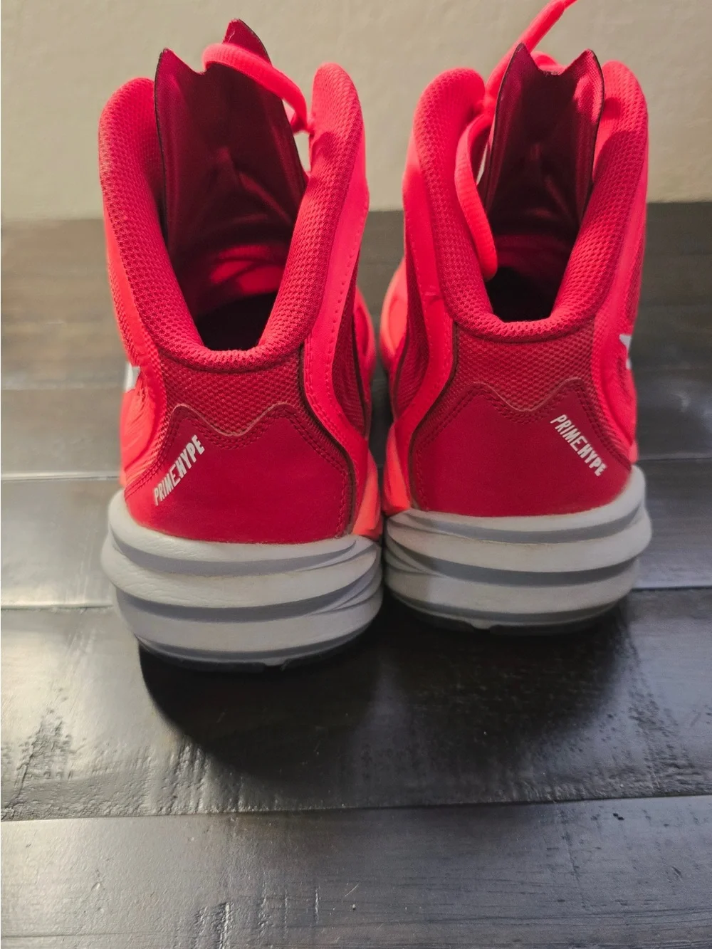 Nike Red High-Top Basketball Shoes with White Swoosh